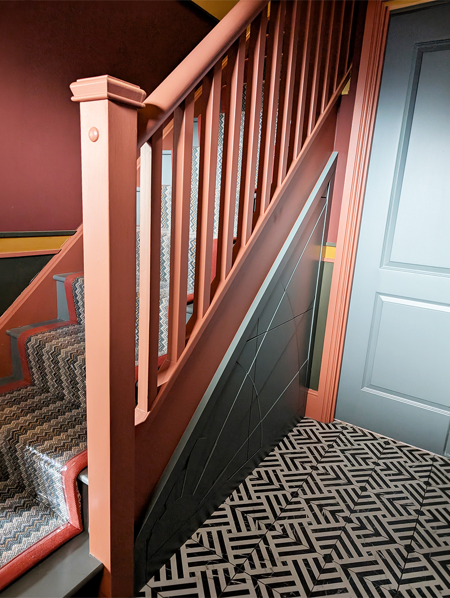 A photo of the staircase in the finshed hallway.