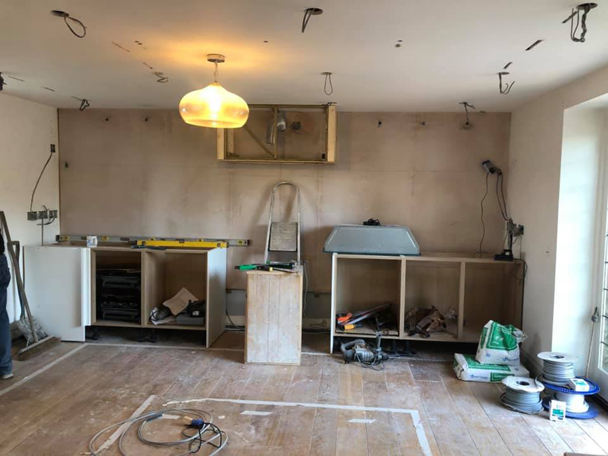 A work in progress photo of the kitchen showing all the first fix cabling in place.