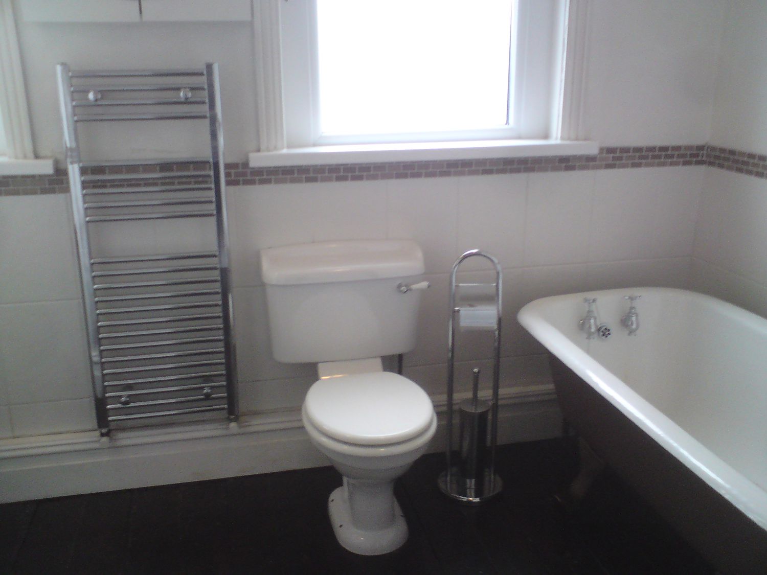 The same view with the old loo with the towel radiator next to it.