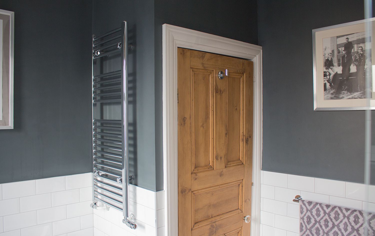 The oak airing cupboard door with a new hook on the back, and the chrome towel radiatior in it's new position.