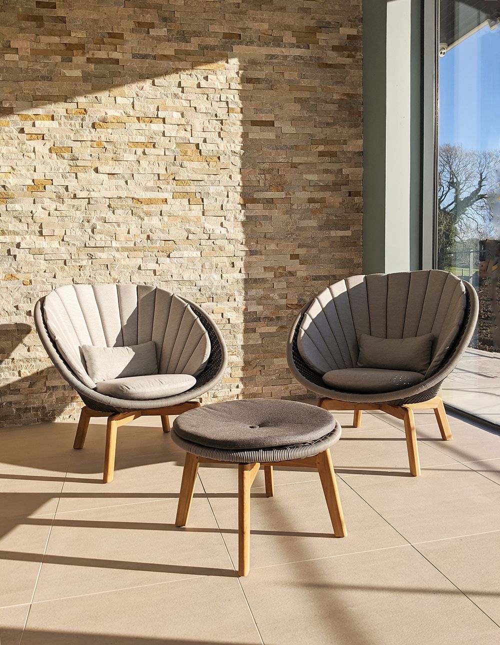 A close up of the seating area by the pool.