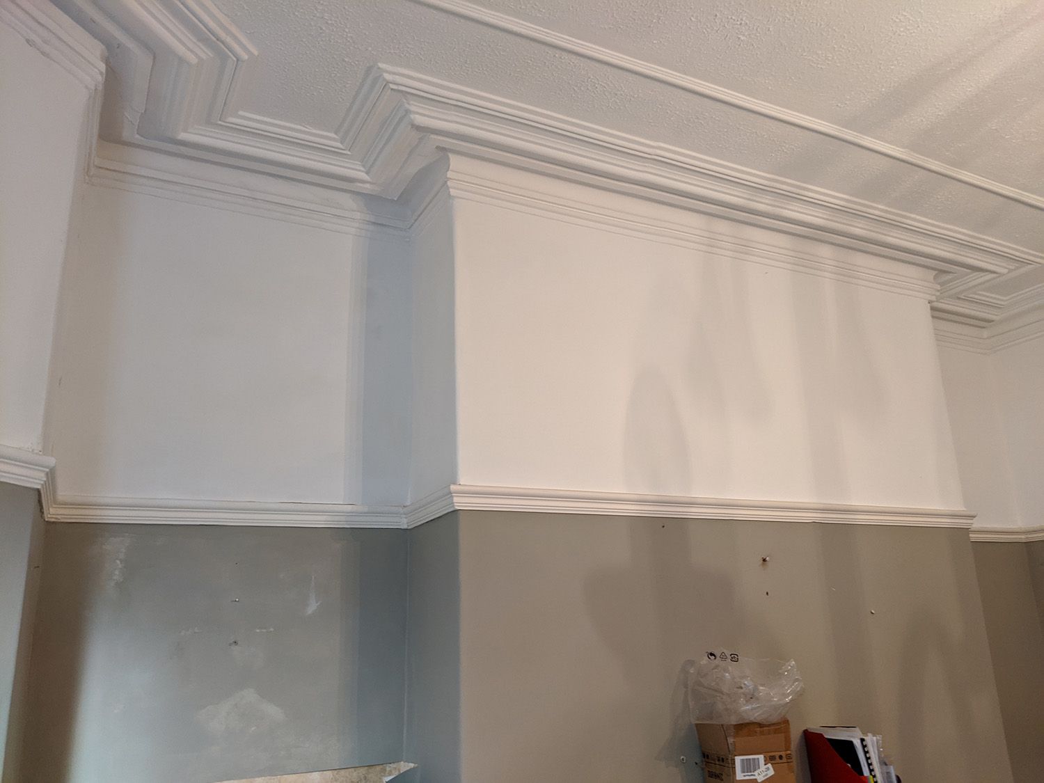 The area above the mantlepiece where the ceiling light would go before work started.