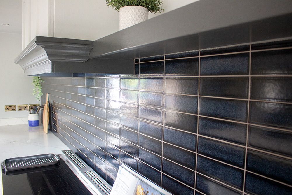 A close up of the navy tiles used as a splashback.