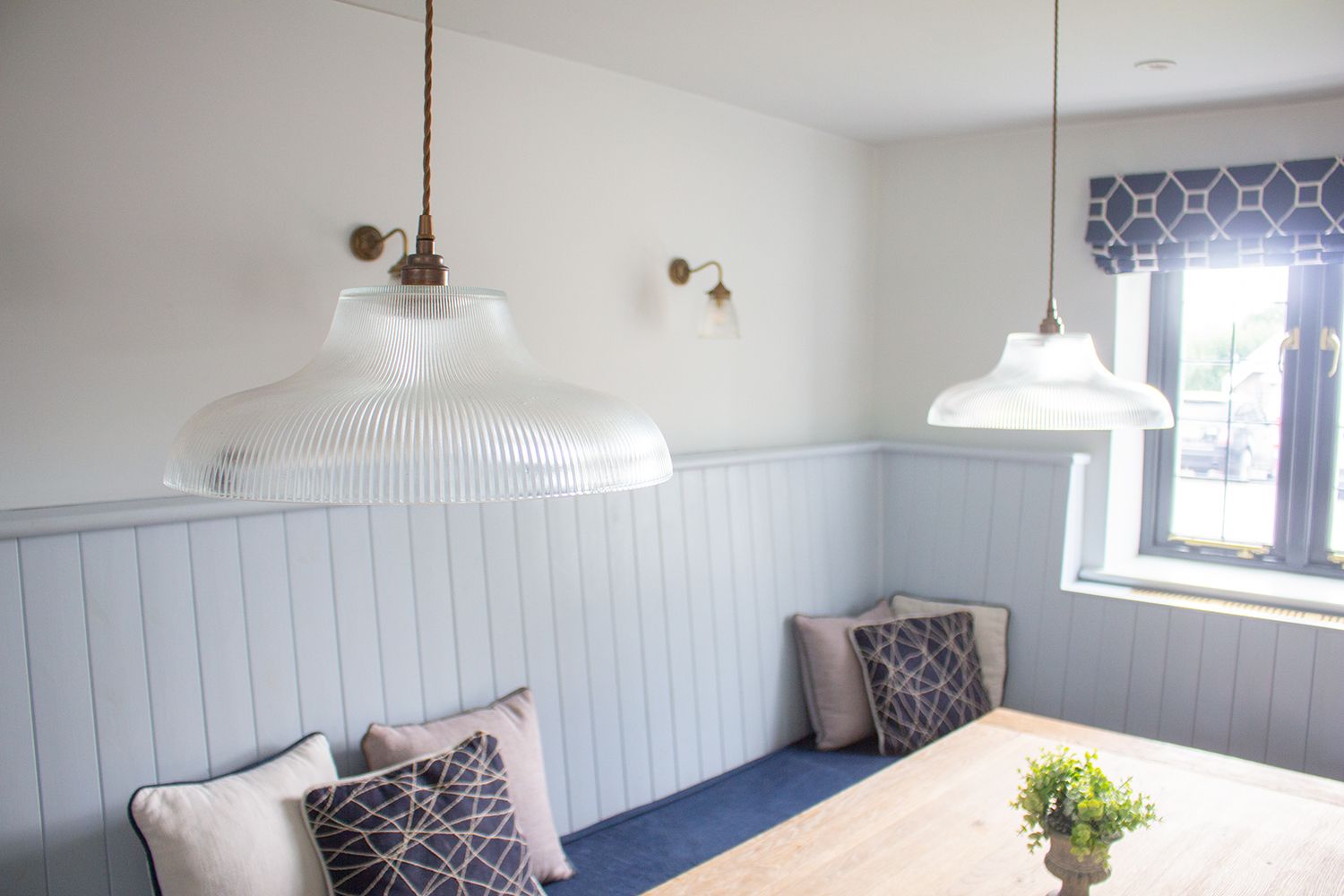 A photo of the two pendant lights over the dining table.