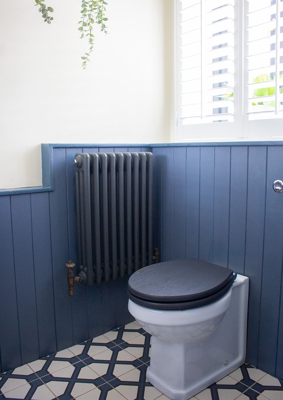 A photo of the blue and white tiles floor in the downstairs loo.