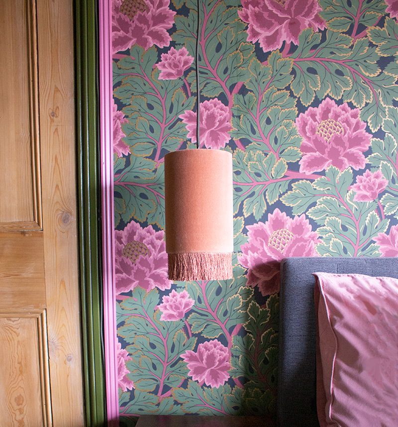A close up of one of the peach velvet bedside lampshades.