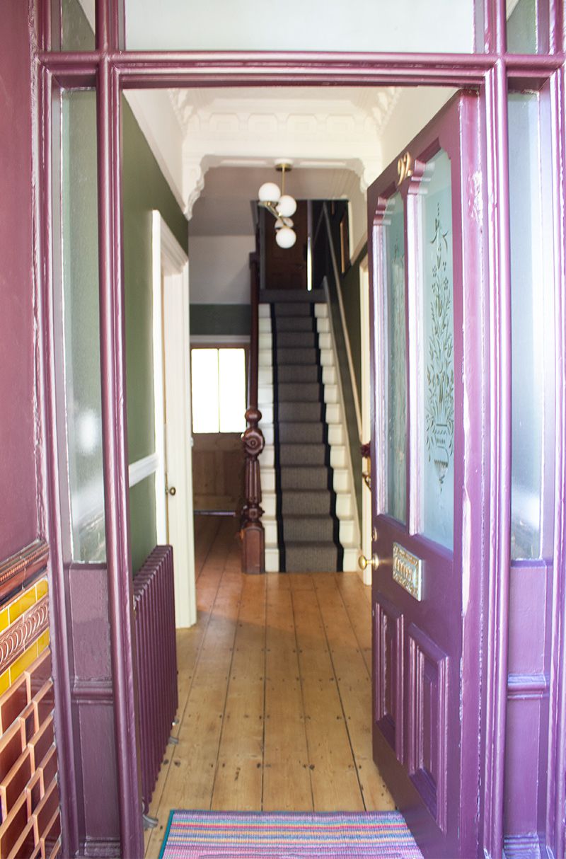 A photo showing the front door open, through to the hallway.