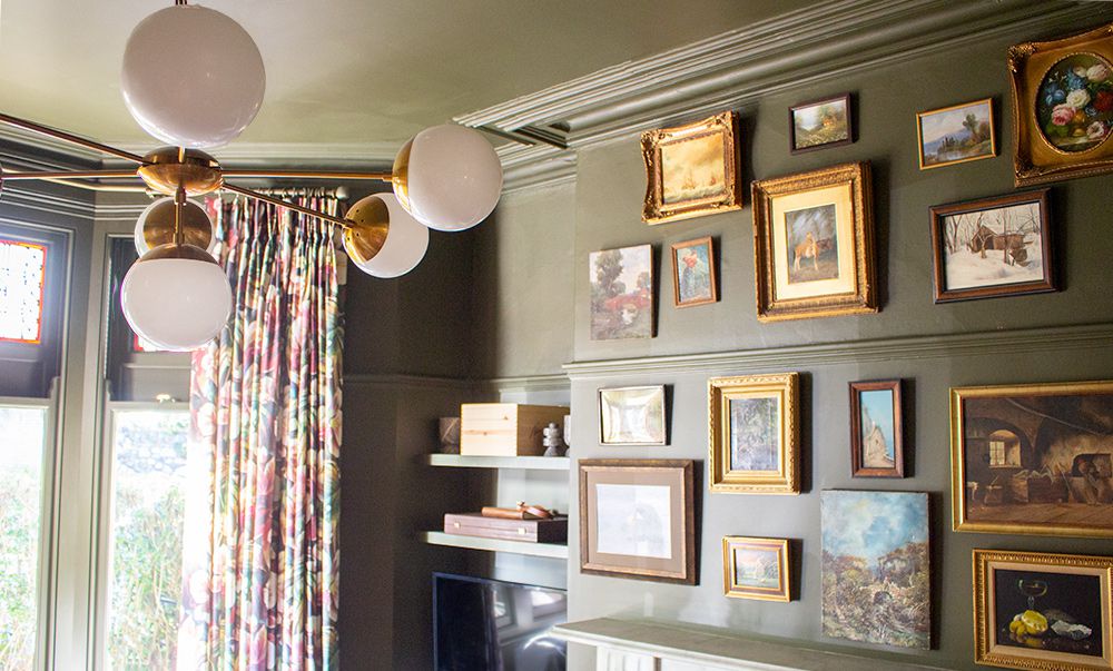 A photo of the brass and opal living room ceiling light, with the room in the background.