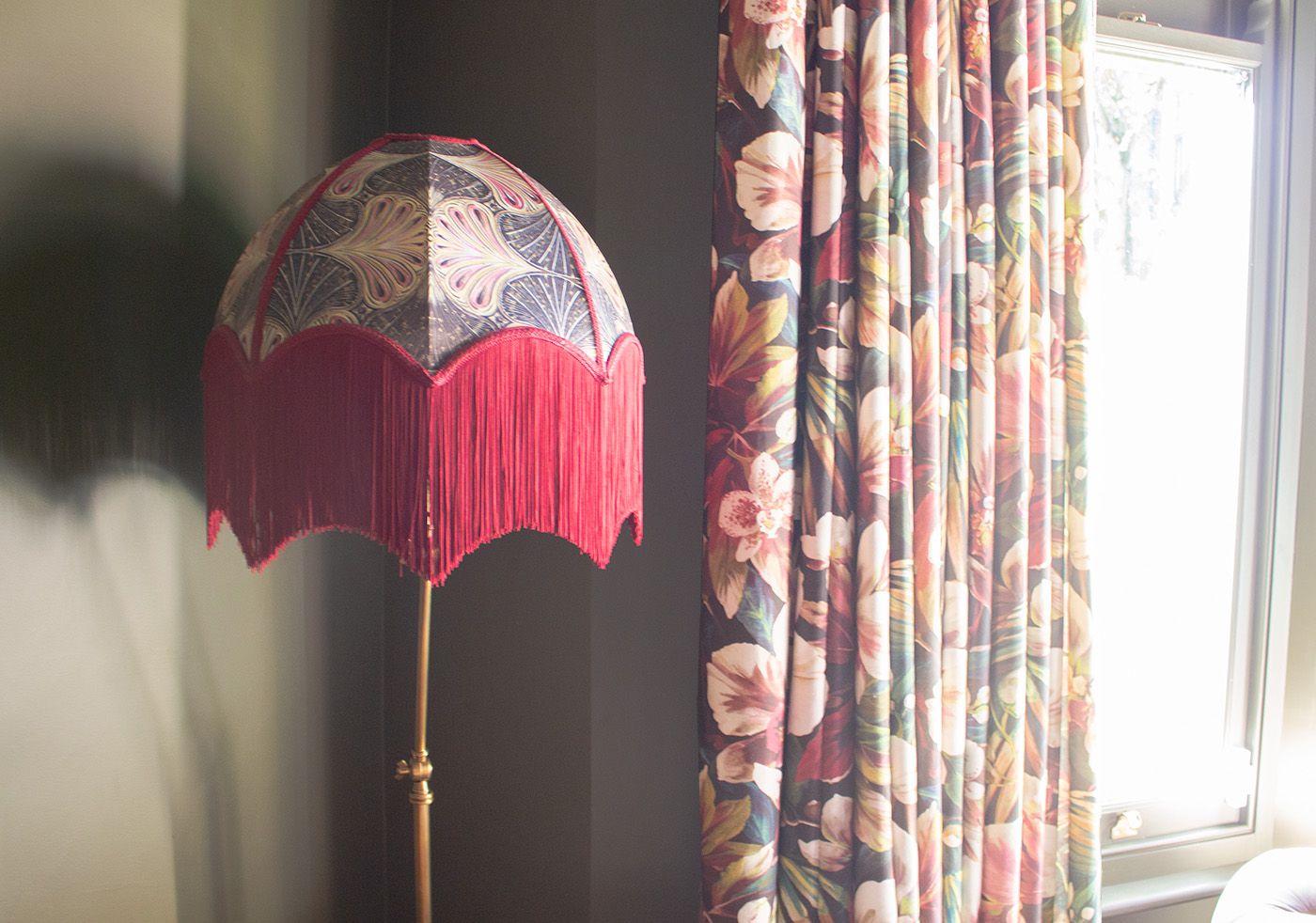 A close up photo of the fringed lamp in the living room.