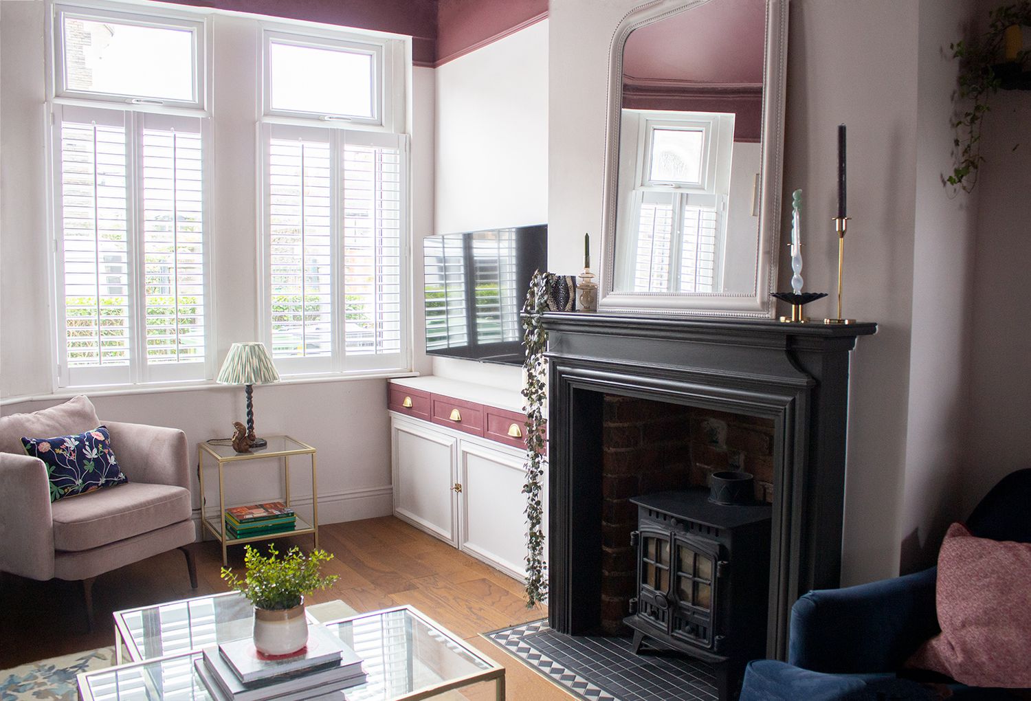 A photo showing the bay window, the TV area and the fireplace.