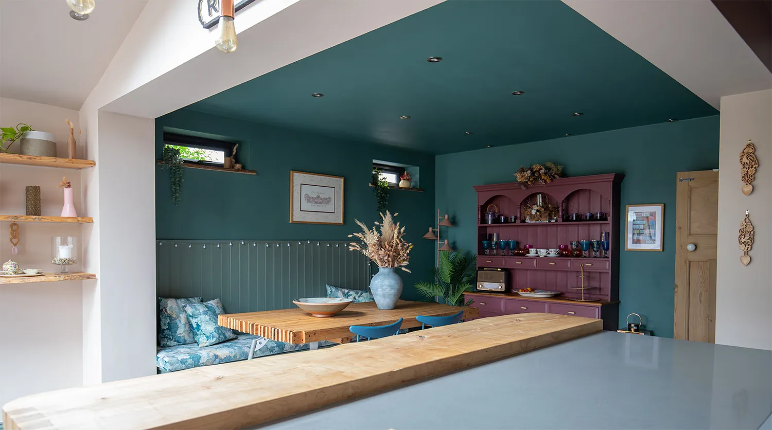 A photo showing a dining table with built in seating