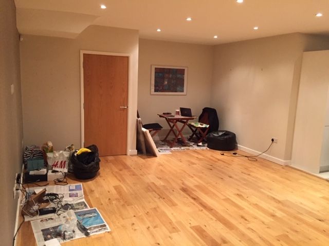 The space where the dining table is was dark and furnished with garden furniture.