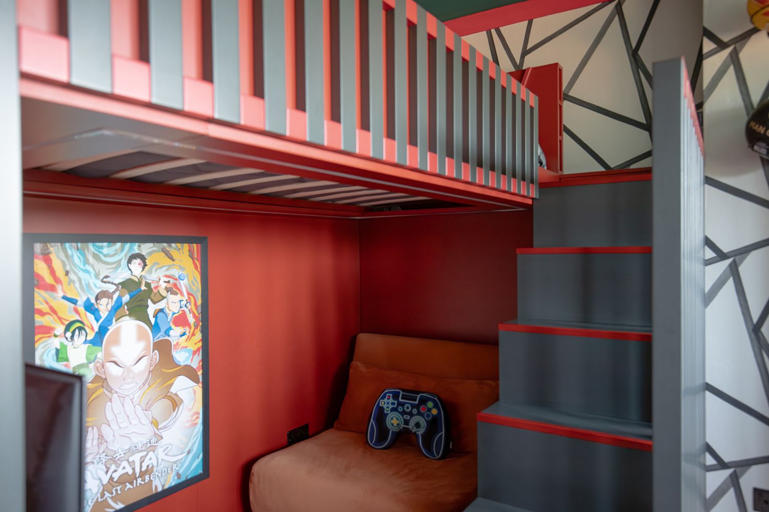 A photo showing the dark grey and red steps up to the new bed.