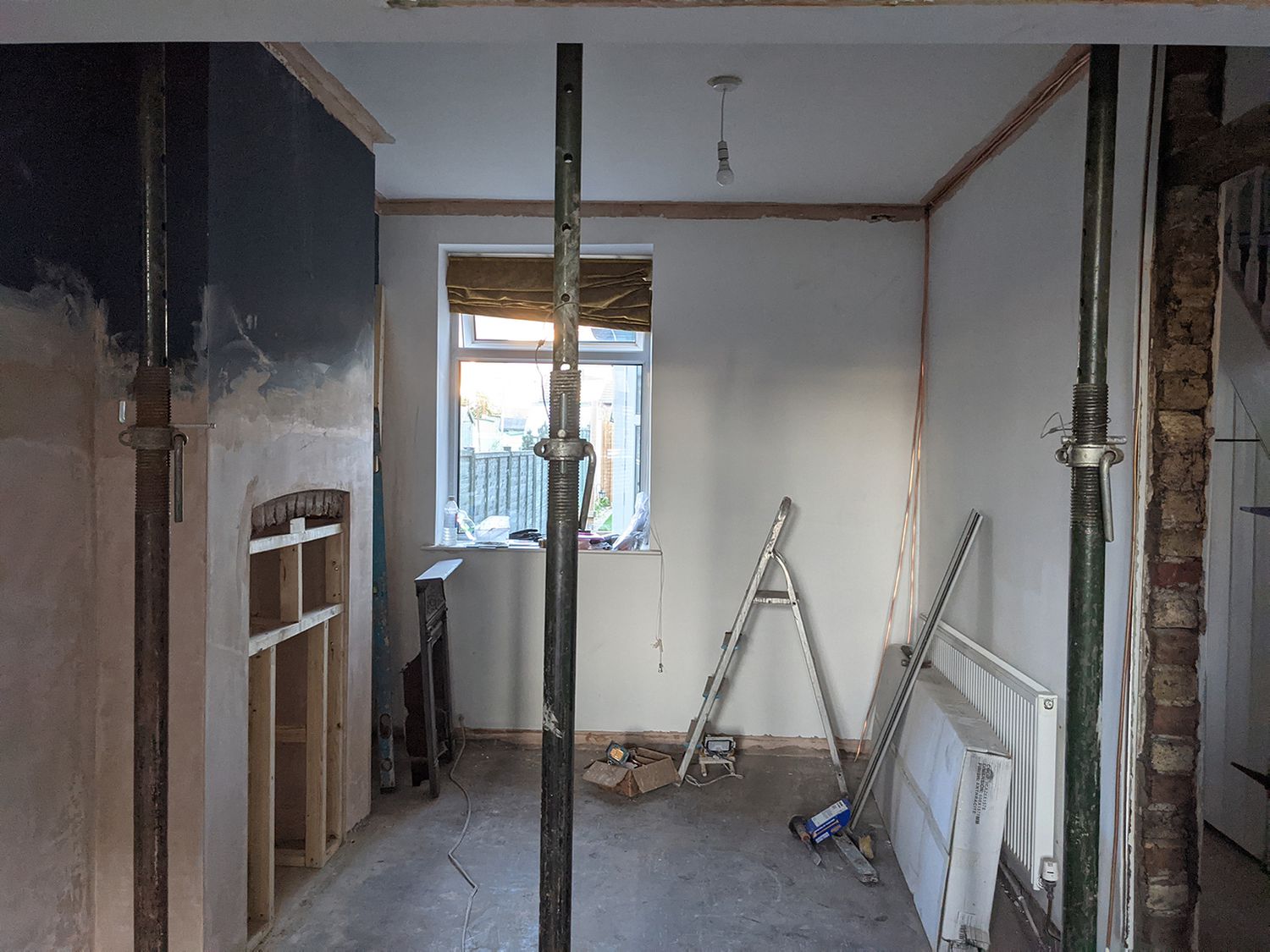 A photo showing the same view of the room towards the window, where the desk will be.