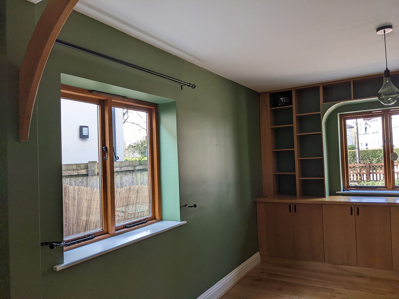 A before photo of the study which had deep green walls.