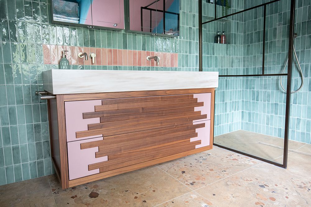 Our bespoke bathroom vanity unit with a walnut design on the front.